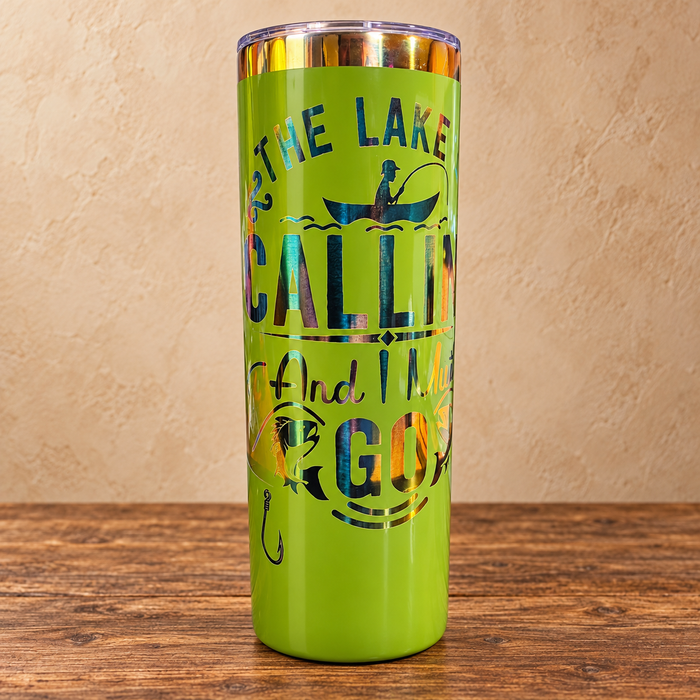 Green 20 oz skinny fishing tumbler with rainbow engraved lake quote
