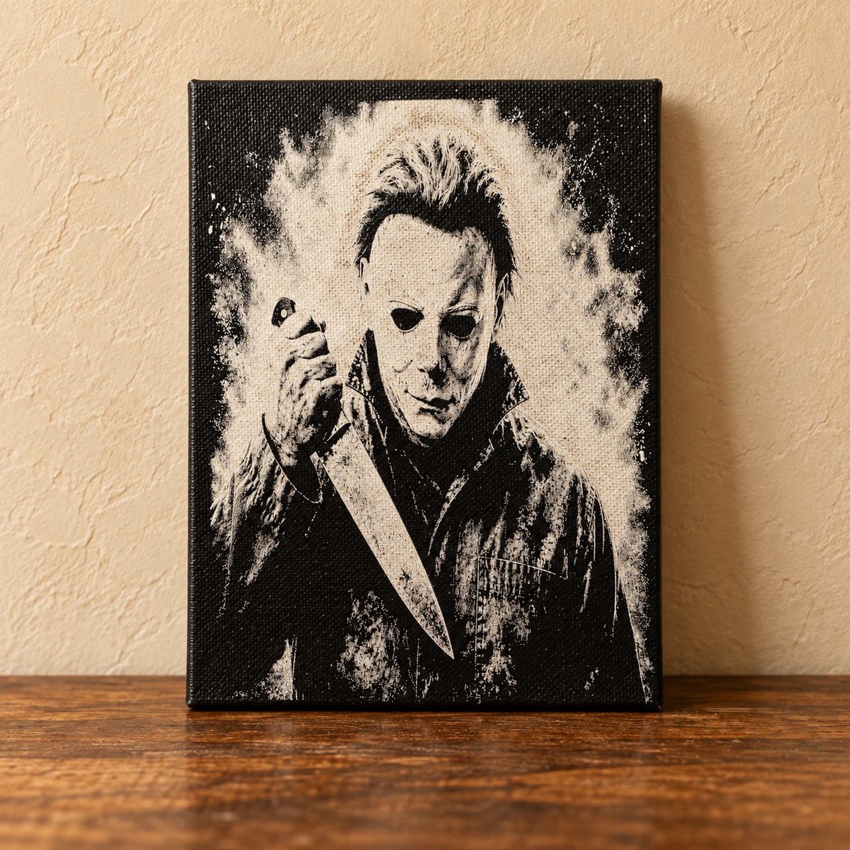 Michael Myers black and ivory canvas art on a rustic tabletop