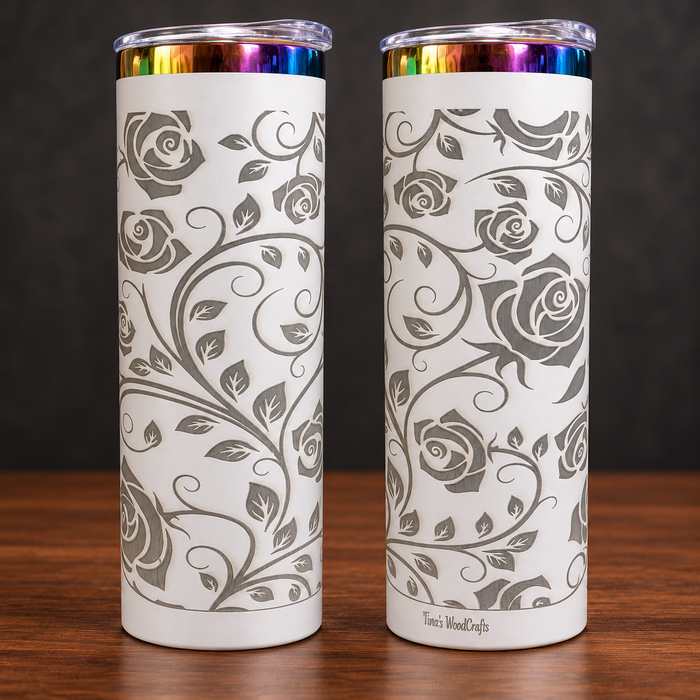 Two sides of one white 20 oz skinny tumbler with silver-gray engraved roses and vines and rainbow metallic rim
