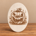 Jack-o'-Lantern Oval Wooden Decoration on professional rustic display
